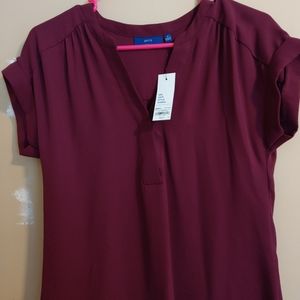 Maroon short sleeve top with rolled sleeves